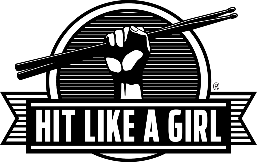 Hit Like A Girl logo with a banderole at the bottom and a hand with sticks