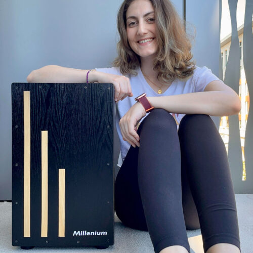 photo of Gizem with her prize the BlackBox Cajón